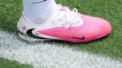 Why are footballers wearing pink boots at the World Cup?